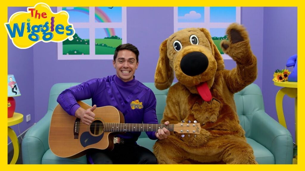 Image de John Wiggle chantant la chanson de l'alphabet ("ABC"). Reproduit avec l'autorisation de The Wiggles Pty Ltd.